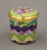 A boxed Moorcroft enamel Heartsease box. 4.25 cm diameter.