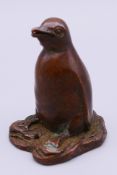 A bronze model of a penguin. 5 cm high.