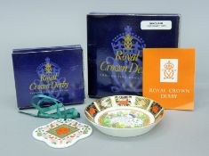 A boxed Royal Crown Derby rabbit pin tray and a boxed Christmas Wreath.