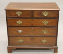 A Georgian mahogany chest of drawers. 86.5 cm wide.