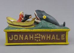 A Jonah and the Whale cast iron money box. 25 cm long.