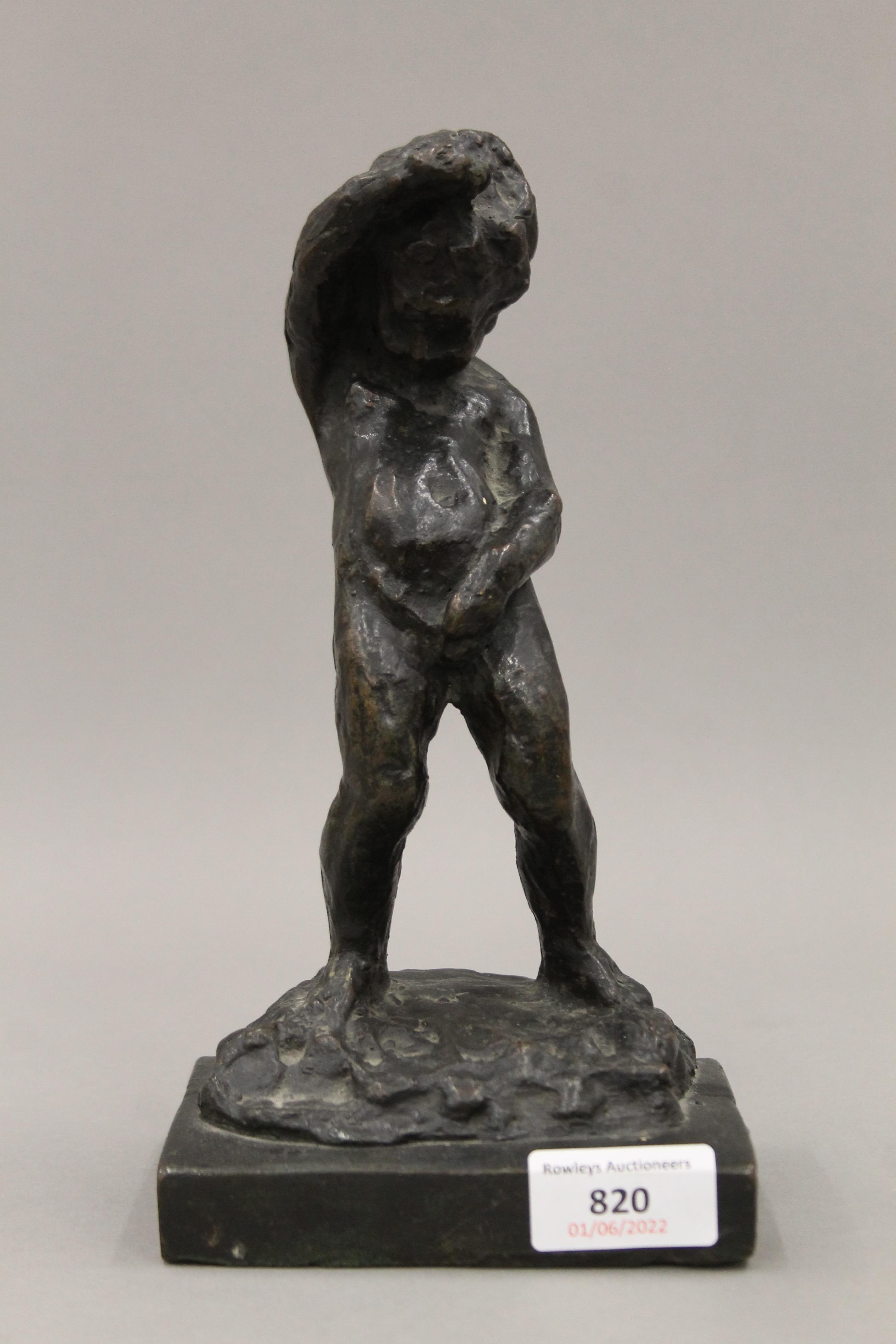 A patinated bronze model of a peeing boy. 23 cm high.