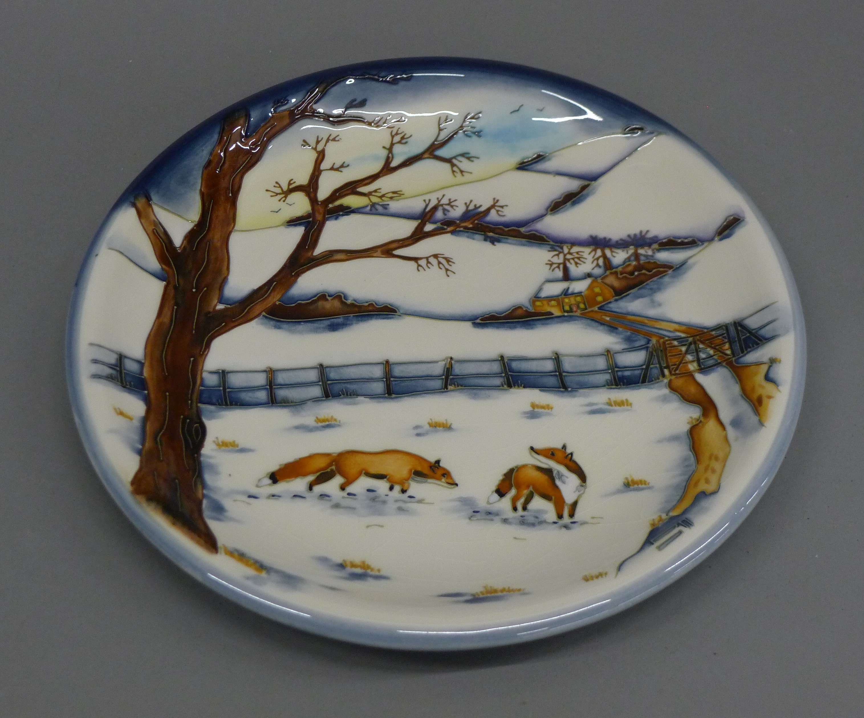 A Moorcroft Woodside Farm plate. 26 cm diameter.