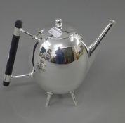 A Christopher Dresser style teapot. 17.5 cm high.