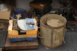 A quantity of various bygones, including a bushell, various trunks and cases, andirons, guillotine,
