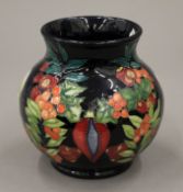 A Moorcroft Guiding Light vase, numbered 41/50. 14 cm high.