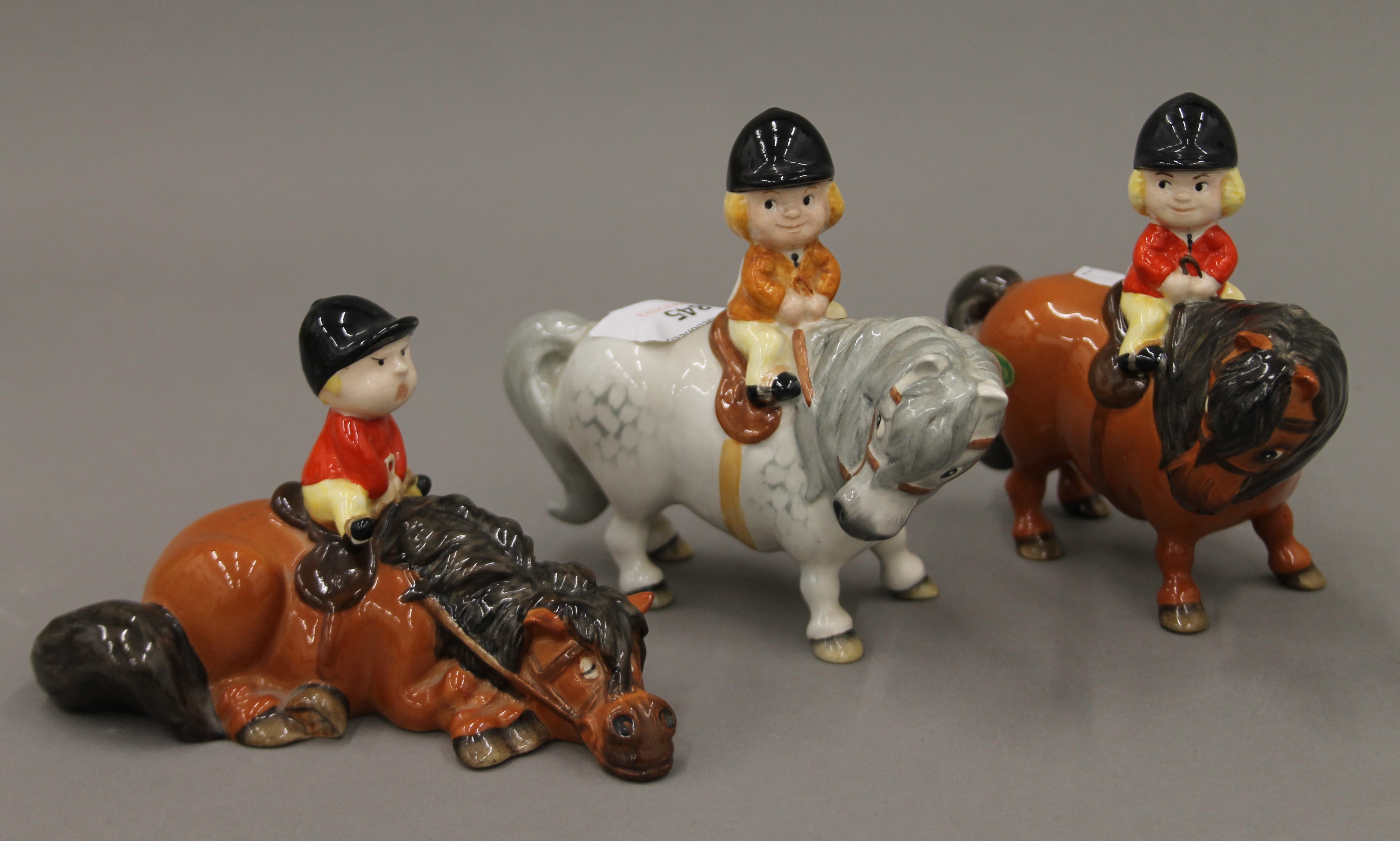 Three Beswick Norman Thelwell models; two Angel on Horse Back and a Kick Start.