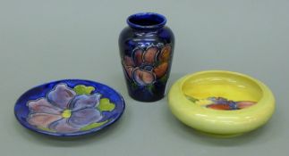 A small Moorcroft Anemone vase, a Pansy pin tray and an Orchid bowl. The former 9 cm high.