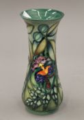 A Moorcroft Rain Forest vase. 21 cm high.