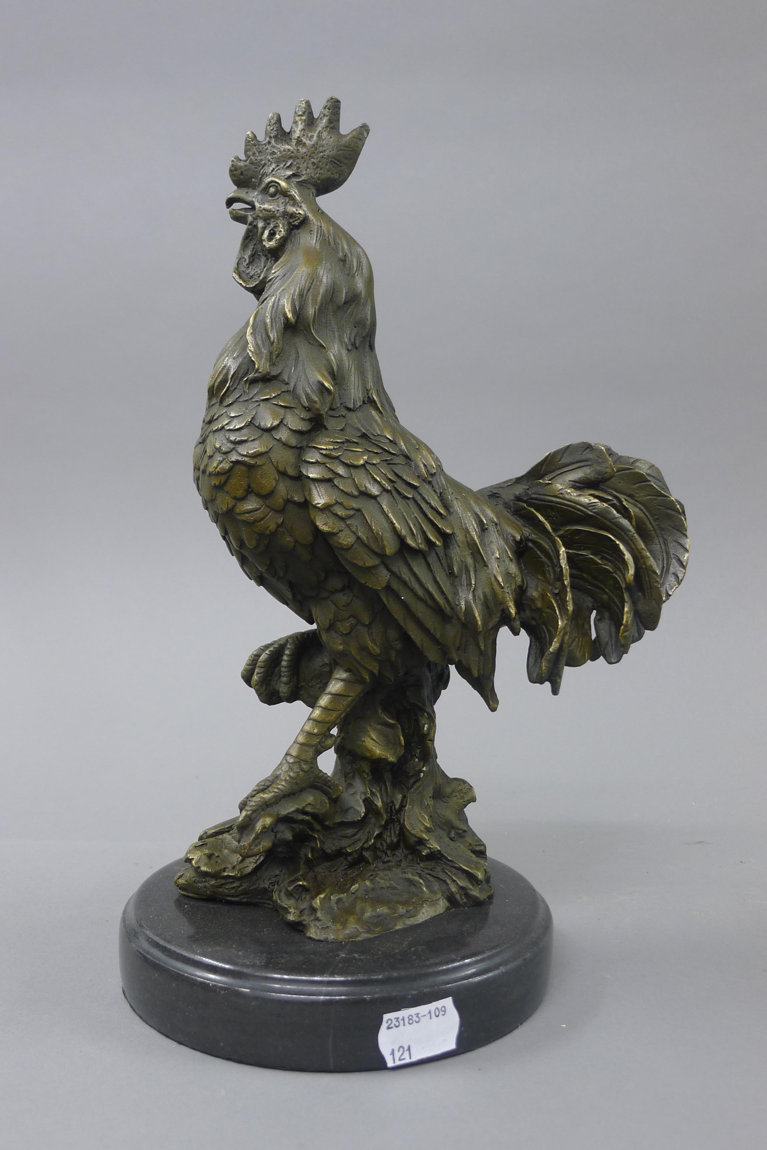 A bronze model of a cockerel. 30 cm high.