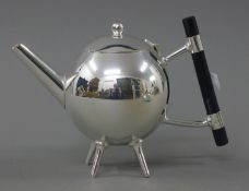 A Christopher Dresser style teapot. 14 cm high.