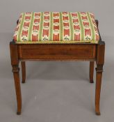 An Edwardian inlaid mahogany piano stool. 49 cm wide.