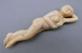 A Chinese type medical figure of a female. 9.5 cm long.