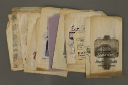 A quantity of vintage shop advertising paper bags.