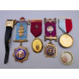 A quantity of Buffalo and Masonic medals, a Raymond Weil wristwatch and a coin.