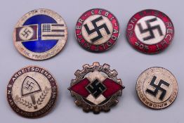 Six Nazi type badges. Largest 2.75 cm diameter.