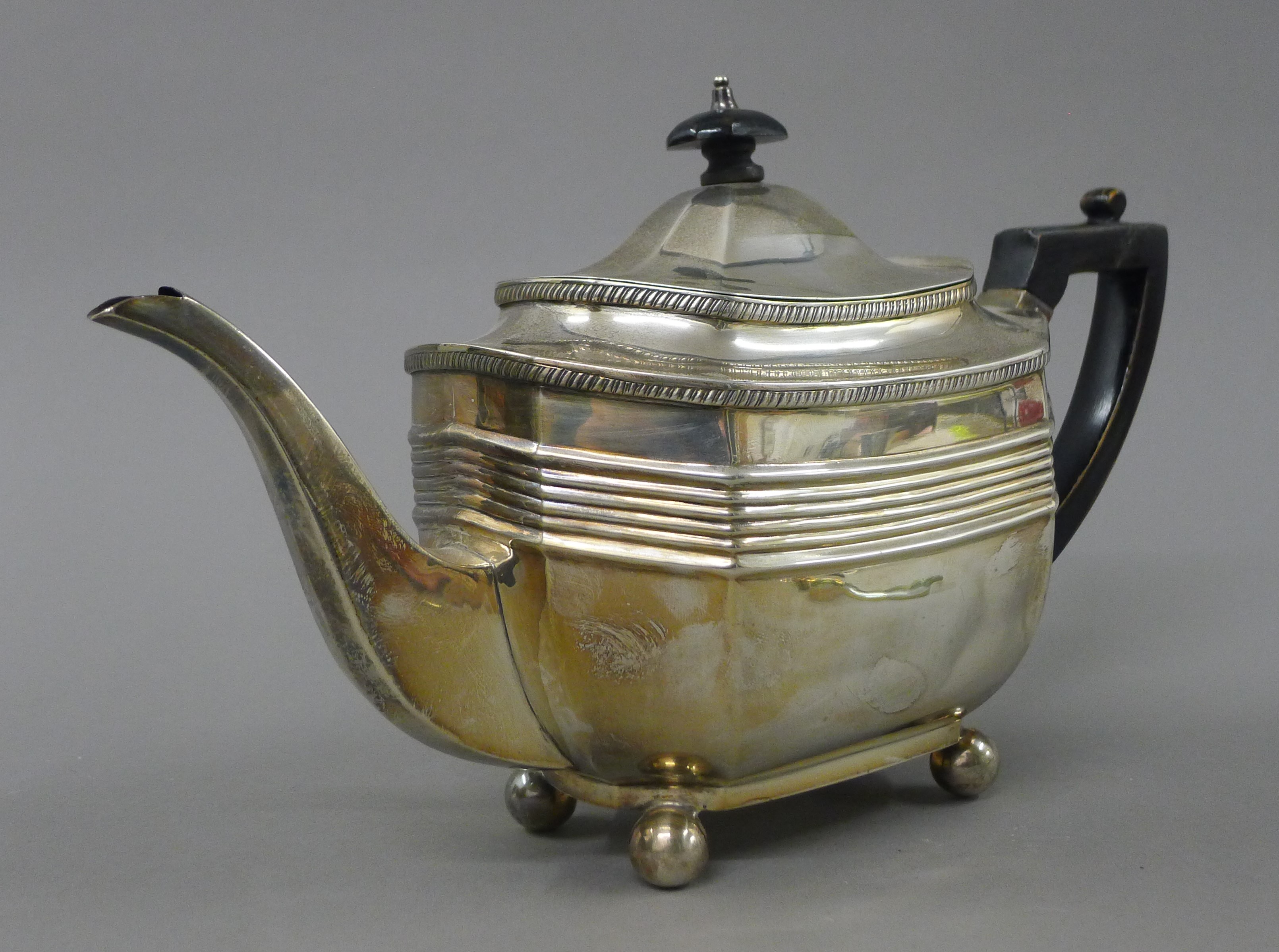 A silver three-piece tea set. The teapot 29 cm long. 854.6 grammes total weight. - Image 3 of 11