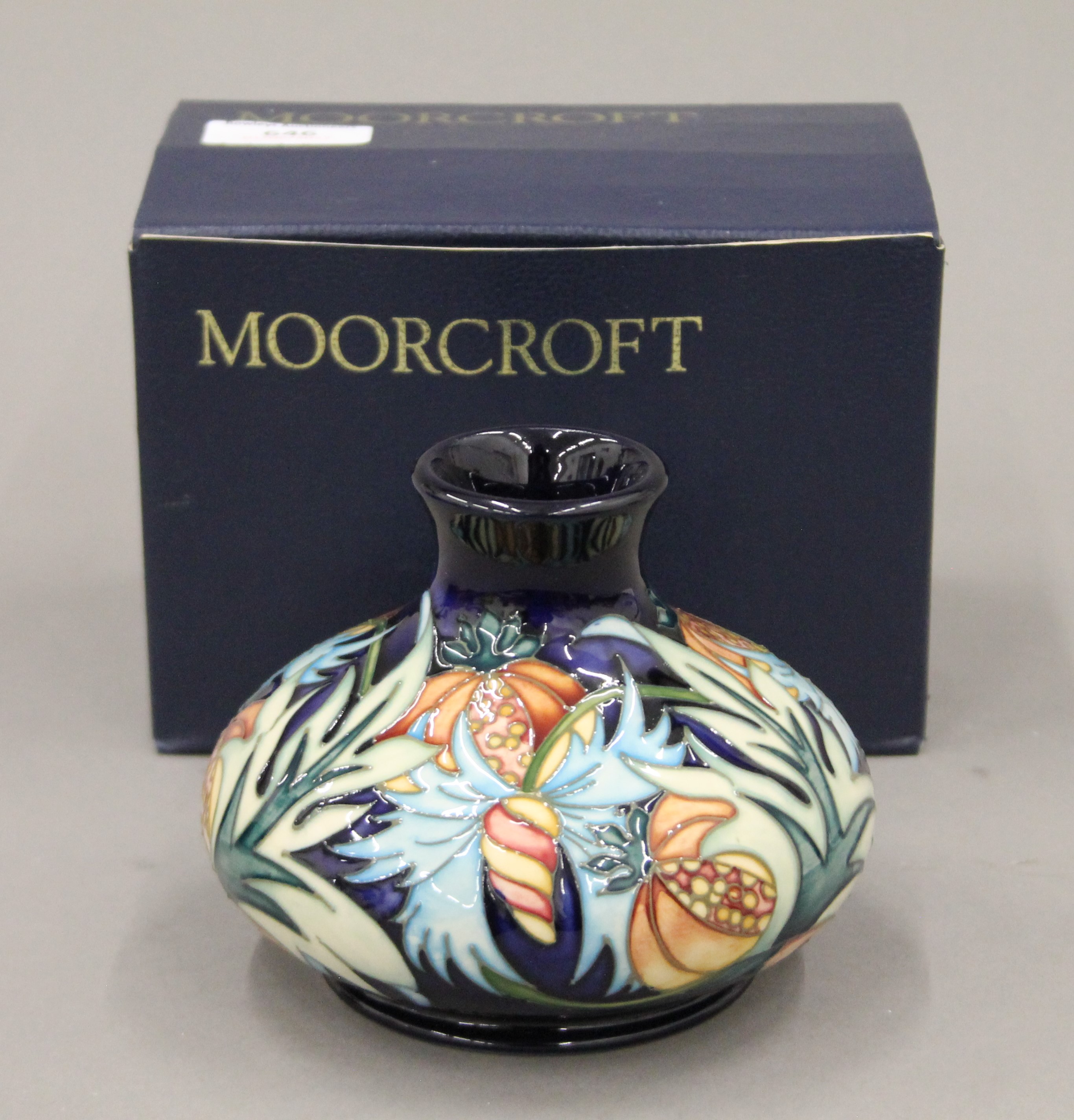 A boxed Moorcroft Paradise Fruit vase, numbered 173/250. 9.5 cm high.