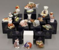 A collection of boxed Royal Crown Derby paperweights.