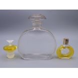 Three perfume bottles: Hermes, Lalique and Baccarat. Baccarat 11 cm high.