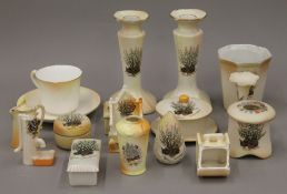 A collection of White Fern crested ceramics.