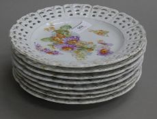 Eight 19th century porcelain ribbon plates. Each 21.5 cm diameter.