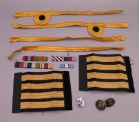 A quantity of military braid/bars and buttons.
