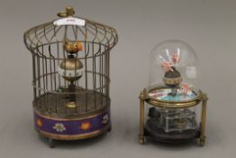 A birdcage clock and a fish clock. The former 19 cm high.
