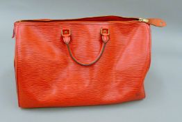 A Louis Vuitton Speedy 35, red epi leather, Made in France 1991, serial number VI0961,