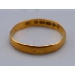 A Victorian 22 ct gold wedding band. Ring size N. 1.3 grammes.