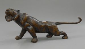 A bronze model of a tiger. 52.5 cm long.