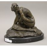 A bronze model of a female nude. 24 cm high.