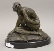 A bronze model of a female nude. 24 cm high.