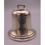 A silver bell form inkwell. 5 cm high.