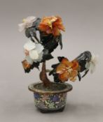 A Chinese hardstone mounted bonsai tree in a cloisonne pot. 18 cm high.
