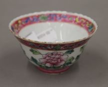 A Chinese famille rose porcelain tea bowl decorated with a phoenix and flowers,