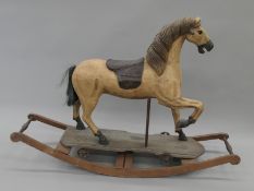 A rocking horse. 123 cm long.