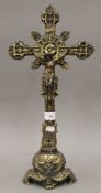 A standing brass crucifix. 53 cm high. From the Robert Browning Settlement Collection Sale.