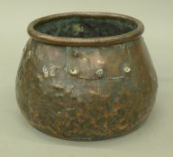 An antique copper jardiniere. 15.5 cm high.