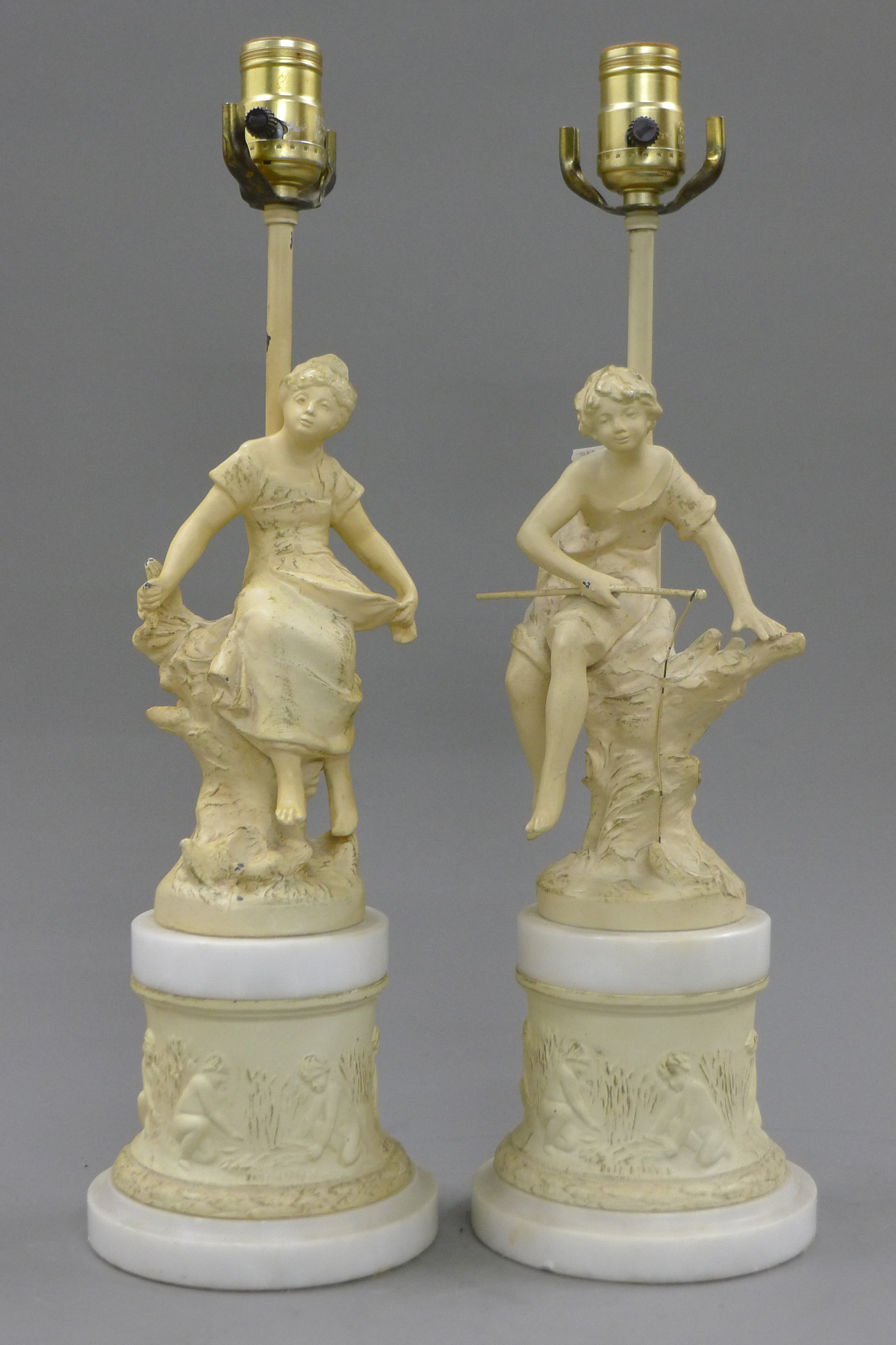 A pair of painted spelter figural lamps. 47 cm high overall.