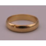 A 9 ct gold wedding band. Ring size L. 2.3 grammes.