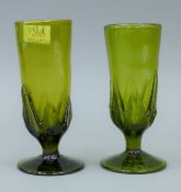 A pair of green Art glass goblets. 17.5 cm high.