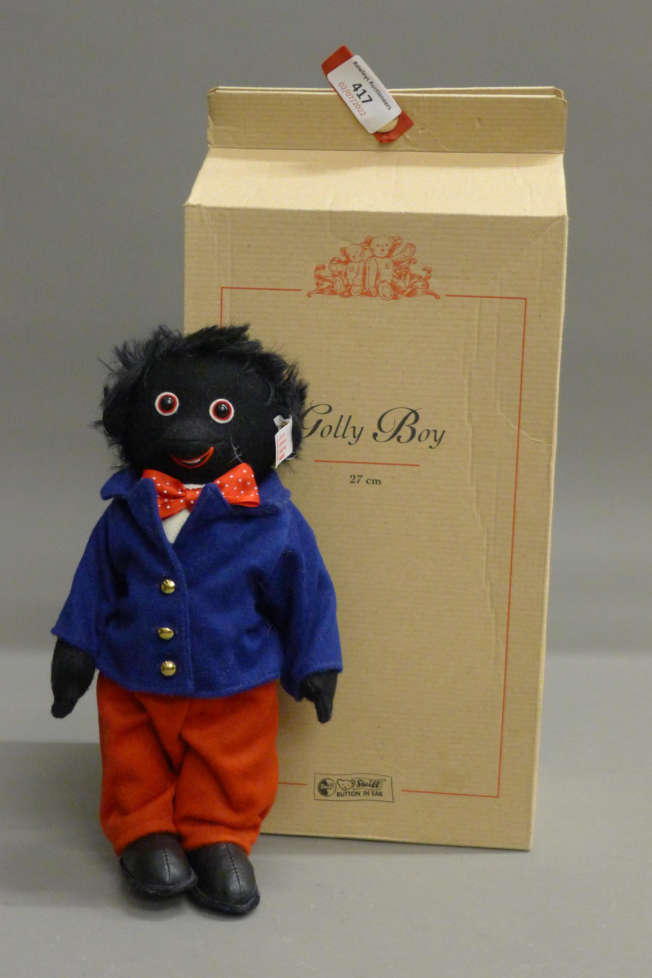 A Steiff Golly Boy, limited edition, numbered 897/2000, with original box and certificate.