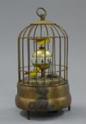 A birdcage clock. 16 cm high.