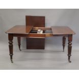 A Victorian mahogany single leaf wind out extending dining table. 162.