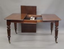 A Victorian mahogany single leaf wind out extending dining table. 162.