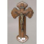 A Continental bronze and walnut crucifix. 45 cm high.