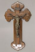 A Continental bronze and walnut crucifix. 45 cm high.