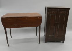 A 19th century mahogany Pembroke table and a side cabinet.