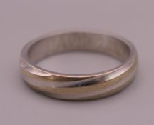 A platinum wedding band, inscribed to inner band DAVID 2.09.06. Ring size I/J. 3.5 grammes.